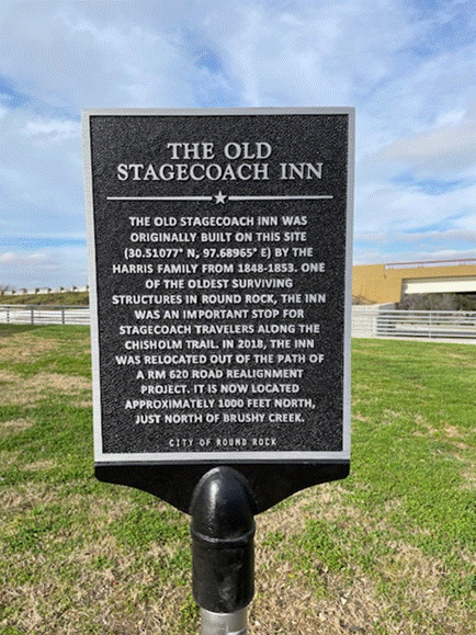 Photo of historic marker for the Old Stagecoach Inn's original site in Round Rock